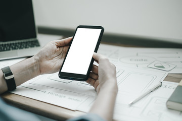 Fototapeta premium Mockup image of ux graphic designer creative smartphone application process development interface for web mobile phone, mockup concept