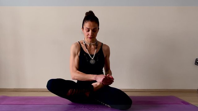 A Yogi is doing Yoga Movements on mat