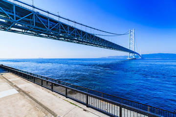 Landscape of Akashi Kaikyo Bridge in the background of blue sky in the summer morning