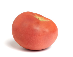 ripe red tomato lies on a white background
