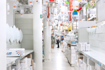 Obraz na płótnie Canvas hardware store blur background. Blurred colorful goods on shelves