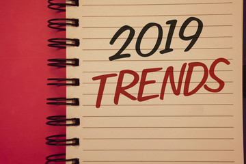 Writing note showing 2019 Trends. Business photo showcasing New year developments in fashion Changes Innovations ModernIdeas Idea messages created on notebook black letters red background