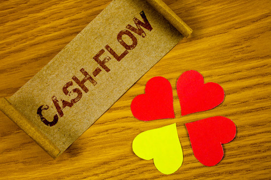 Text sign showing Cash-Flow. Conceptual photo Virtual movement of money by company finance department statistics written Folded Cardboard Paper piece wooden background Paper Hearts next to it