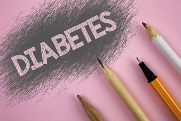 Text sign showing Diabetes. Conceptual photo Medical condition diagnosed with increased high level sugar written Pink background Pen and pencils next to it.