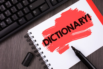 Writing note showing Dictionary Motivational Call. Business photo showcasing Learning another vocabs and synonyms from book written Painted Notepad wooden background Keyboard and Marker.