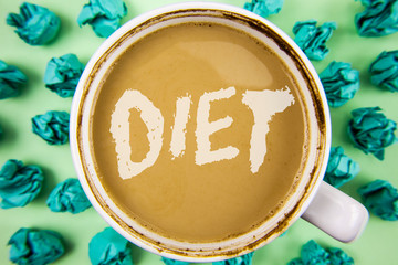 Word writing text Diet. Business concept for Dietitians create meal plans to adopt and maintain healthy eating written Tea in white Cup within Crumpled Paper Balls plain background.