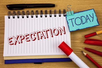 Conceptual hand writing showing Expectation. Business photo text Meteorological research analyst predicts weather forecast written Noteoad wooden background Today Pen Pencil next to it