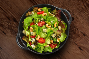 Fresh green salad pan isolated on white background