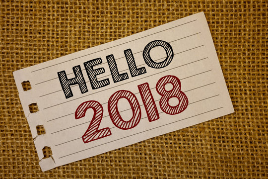 Text sign showing Hello 2018. Conceptual photo Starting a new year Motivational message 2017 is over nowNotebook page ideas message black red letters words wicker background