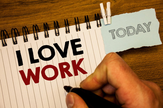Text sign showing I Love Work. Conceptual photo To be happy satisfied with job Be doing what you most likeMan creating for today on notebook Hand hold holding pen Wooden background