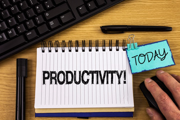 Text sign showing Productivity Motivational Call. Conceptual photo Effective work Great perfomance Success focus written Noteoad wooden background Hand Mouse Today Pen Keyboard