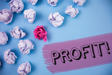 Word writing text Profit Motivational Call. Business concept for Earned Money Payment Salary Business Revenue written the Painted background Crumpled Paper Balls next to it.