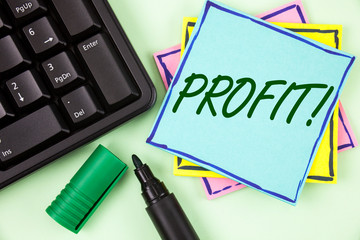 Handwriting text writing Profit Motivational Call. Concept meaning Earned Money Payment Salary Business Revenue written Sticky Note paper plain Green background Marker and Keyboard.