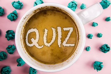 Handwriting text Quiz. Concept meaning Short Tests Evaluation Examination to quantify your knowledge written Coffee in White Cup within Crumpled Paper Balls plain pink background.