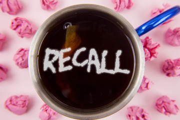 Conceptual hand writing showing Recall. Business photo showcasing Bring back to memory Ordering the return of a person or product written Tea in Cup within Paper Balls plain background.