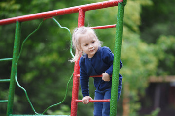 Cute little girl playing on the playground