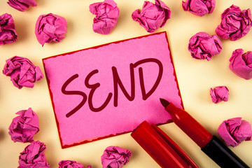 Word writing text Send. Business concept for Arrange something to be delivered Mail a thing Deliver a message written Pink Sticky Note Paper plain background Paper Balls and Marker.