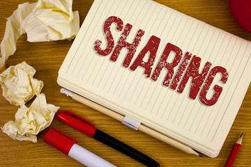 Conceptual hand writing showing Sharing. Business photo showcasing To Share Give a portion of...