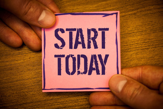 Conceptual hand writing showing Start Today. Business photo texts Initiate Begin right now Inspirational Motivational phraseMan hold holding pink note ideas black letters wooden background
