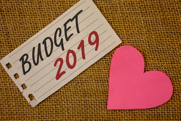 Text sign showing Budget 2019. Conceptual photo New year estimate of incomes and expenses Financial PlanNotebook page Wicker background Pink Heart Black Red letters Love note