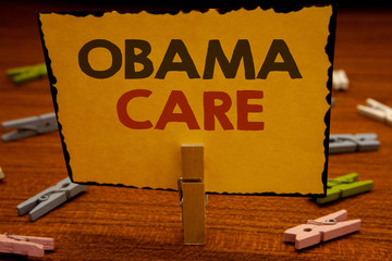 Words writing texts Obama Care. Business concept for Government Program of Insurance System Patient...