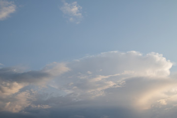 Naklejka na ściany i meble Contrast cumulus clouds on a blue sky.