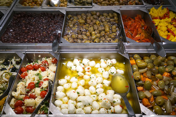 variety of colorful fresh olive and vegetable salad in restaurant