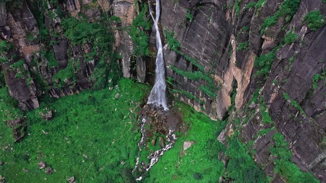 Aerial view of Jogini waterfall in manali , himachal pradesh / droning jogini waterfall .