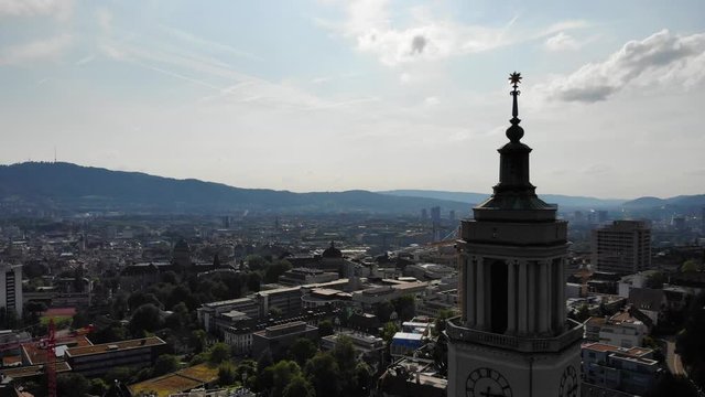Beautiful drone aerial of Z&uuml;rich, the biggest city in Switzerland. Shot is moving down. On the right and in the front there is a church, located in Fluntern.