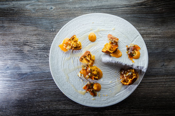 top view on exquisite restaurant dessert of cupcakes with sweet sauce