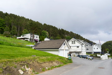 Fototapeta na wymiar Rural houses in Alesund village in summer, Norway