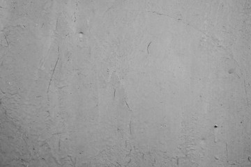 Texture of a concrete wall with cracks and scratches which can be used as a background