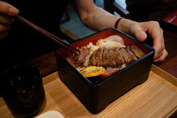 Eating perfectly cooked steak in high-class Japanese restaurant