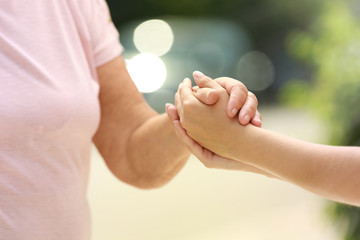 People, care and support. Giving helping hand concept