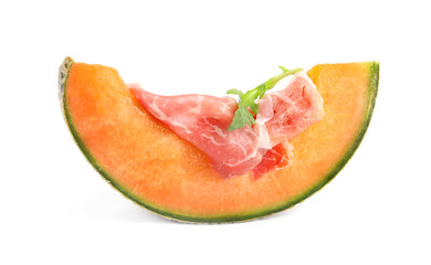 Slice of fresh melon with prosciutto and arugula on white background