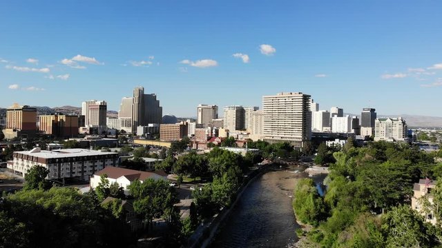 Flying Towards Reno City Skyline Over the Truckee River - Aerial Drone.