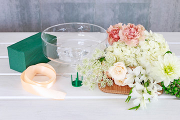 How to make floral decorations on summer party table. Centerpiece with rose, dahlia and hortensia...