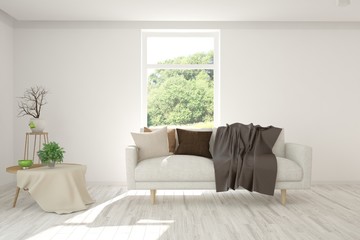 Stylish room in white color with sofa and summer landscape in window. Scandinavian interior design. 3D illustration