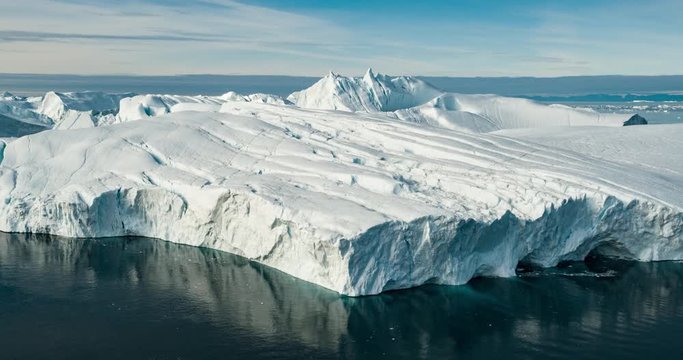 Arctic icebergs in Greenland, drone view. Global warming concept.
