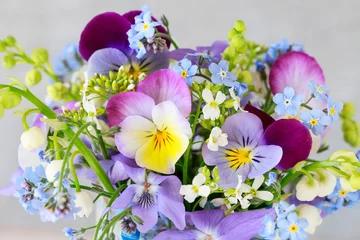 Fotobehang Pansy, forget-me-not, violet and lily of the valley flowers in one beautiful bouquet © agneskantaruk