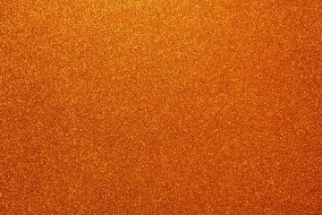 Orange glitter. Abstract shiny background. Design paper texture for decoration and design of...