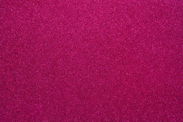Fototapeta premium Magenta glitter. Abstract shiny background. Design paper texture for decoration and design of Christmas, New Year or other holiday pictures. Beautiful packaging material.