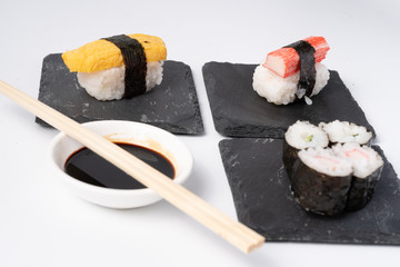 Mix sushi set, Japanese food on slate platte isolated white background