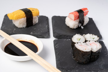 Mix sushi set, Japanese food on slate platte isolated white background