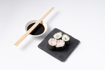 Mix sushi set, Japanese food on slate platte isolated white background