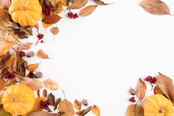 Autumn composition. blanket, autumn leaves and pumkin on white background. Flat lay, top view copy space.