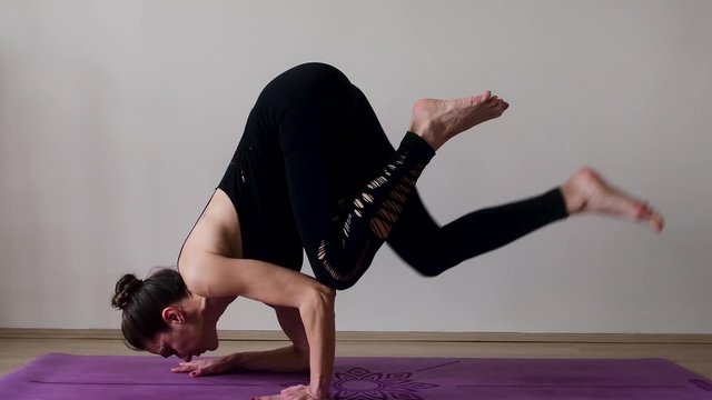 A Yogi is doing Yoga Movements on mat