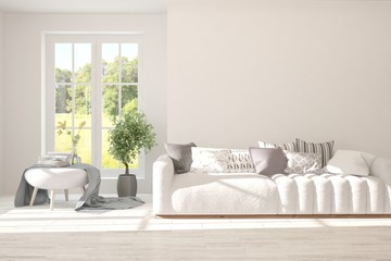 Stylish room in white color with sofa and summer landscape in window. Scandinavian interior design. 3D illustration