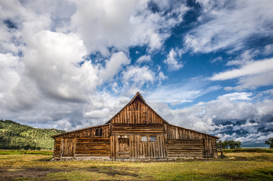 Rustic Barn in Front of Cloud-Covered Tetons