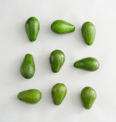 Fresh ripe avocados on white background